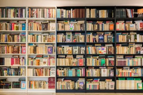 Bookshelf In Library With Many Old Second-Hand Books Stock Photos