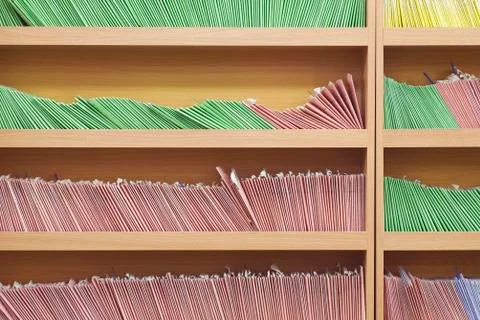Bookshelves with rows of paperbacks Stock Photos