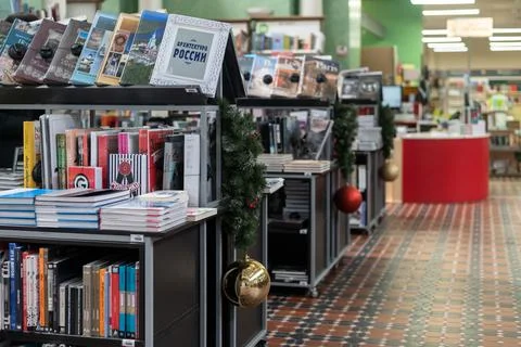Bookstore without visitors. The bookshelves are filled with books. Stock Photos