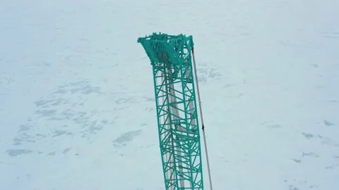 Boom of a crane on the background of an ice field with snow. Stock Footage 153469250