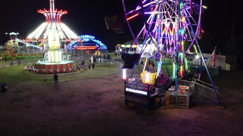 Boom Up to extreme angle of Ferris Wheel - pause - then boom down Stock Footage 254934874
