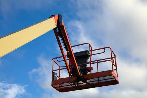 Boom lift construction site elevator equipment lifting platform picker on sky Stock Photos