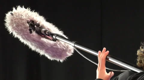 Boom operator holding microphone 動画素材 59950654