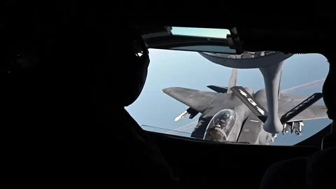 From boom operators window F-15 Strike Eagle approaching for aerial refuel Stock Footage 295033785