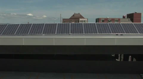 Boom up on solar panles in city setting Stock Footage 7765129