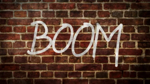 Boom spray painted on the brick wall Stock Footage 154293314