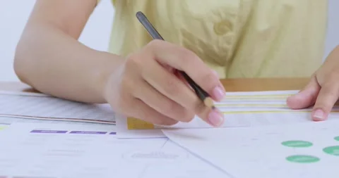 Boost productivity tips for document analysis a bright focused home office Stock Footage 313938666