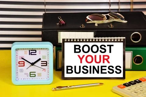Boost your business. A text label in the planning notebook. Stock Photos
