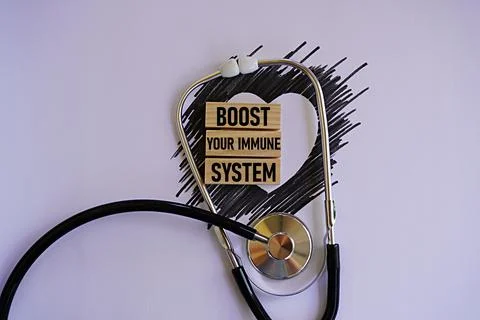 BOOST YOUR IMMUNE SYSTEM printed woodblock. Healthcare concept Stockfoto's
