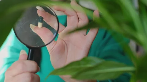 Boost your morning routine with chlorophyll! A young woman sips on chlorophyll, Stock Footage 267229269