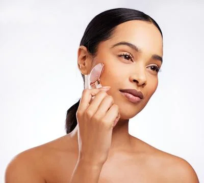 Boosting circulation to help clear toxins and decrease puffiness. Studio shot of Stock Photos