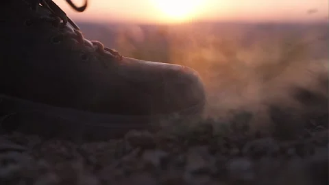 Boot close-up. A man climbs a mountain at sunset Vídeos de archivo 158638514