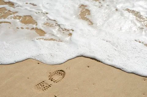 Boot  foot print on the shore Stock Photos