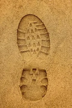 Boot Footprint with crampons in wet sand Stock Photos