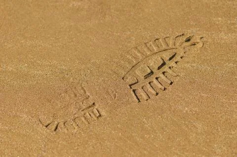 Boot footprint on the sand Stock Photos