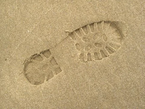 Boot footprints in sand Stock Photos