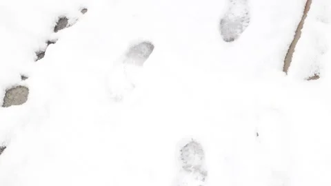 Boot footprints in the snow Stock Footage 134585481