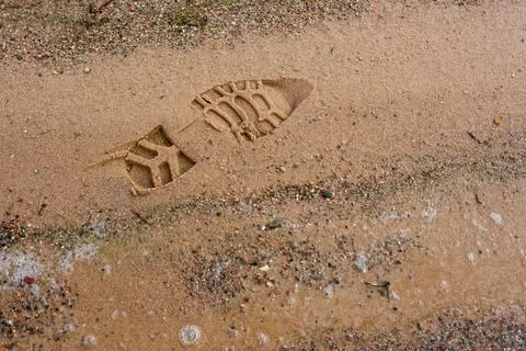 Boot imprint on the beach sand Stock Photos
