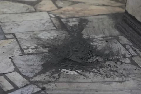 Boot mark on coal dust on the stone floor. Stock Photos