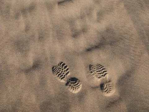 Boot prints in desert sun Stock Photos