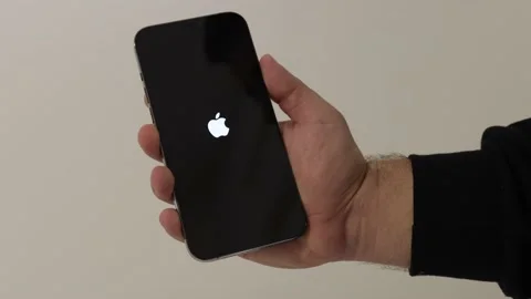 Booting up iPhone 12 Pro Max, apple logo on screen Stock Footage 145193999