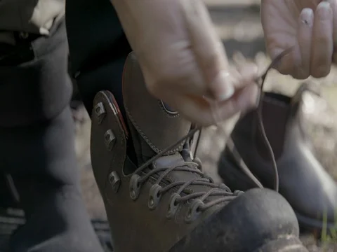Boots Being Tied Up in Forest Fly Fishing Pacific Northwest Stock Footage 76129704