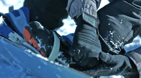 Boots clipping into snowboard bindings Stock Footage 47341535