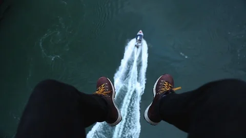 Boots Dangle Over Boat Видео 109237388