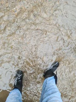 Boots in the flood Stock Photos