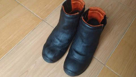 Boots on the floor Stock Photos