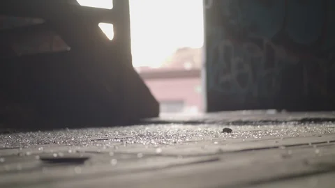 Boots Man Walking Through Abandoned Warehouse Video stock 113531668