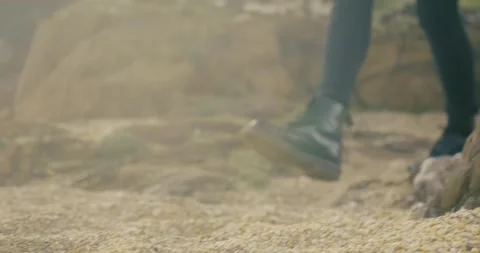 Boots On Pebble Beach Stock Footage 284744015