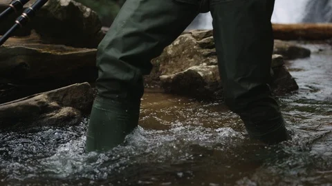Boots in river Stock Footage 128784285