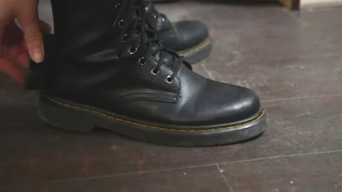 Boots rub to shine clean shoes Stock Footage 222657323