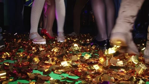 Boots stomp through the confetti shower at New Year's Eve party Stock Footage 315748398
