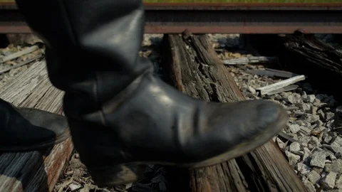 Boots walk down rails - building the Transcontinental RailRoad - 1800s Stock Footage 99754575