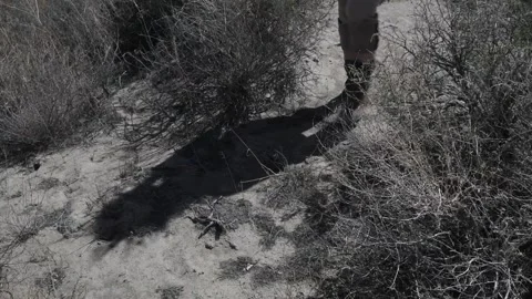 Boots, walking in desert sand Stock Footage 151116328