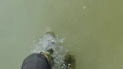 Boots walking through slush and ice pov slow motion wide angle Stock Footage 61374818