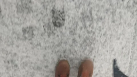 BOOTS WALKING THROUGH SNOW ON FOOTPATH 4K Stock Footage 147130473