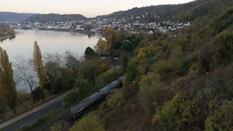 Boppard Rhine River Bend freight train pass Aerial Autumn Forest Village Germany 動画素材 338409582