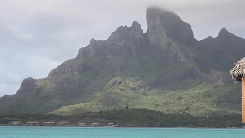 Bora Bora - Boat Passing Mountain Stock Footage 103334529