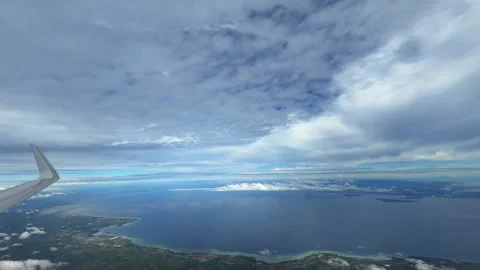 Boracay island flight over Pacific Ocean Philippines plane window view Stock Footage 340544262