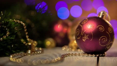 Bordeaux Christmas ball with a pattern on the background bokeh Stock Photos