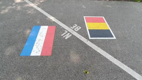 The border between belgium and the netherlands drawn on the street Vídeos de archivo 165458989