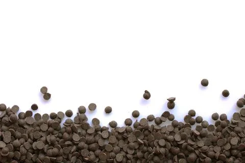 Border of chocolate chips on white Stock Photos