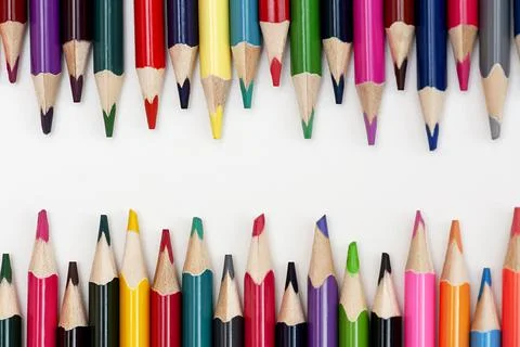 Border of colored pencils on white background, copy space Stock Photos