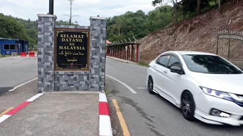 The border crossing between Malaysia and Thailand Stock Footage 269299484