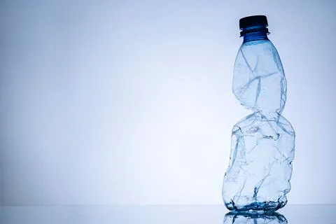 Border of a crumpled empty clear plastic bottle Stock Photos