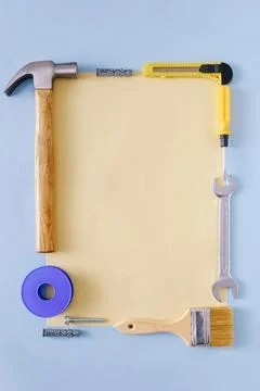Border of DIY hardware surrounding a blank page of paper Stock Photos