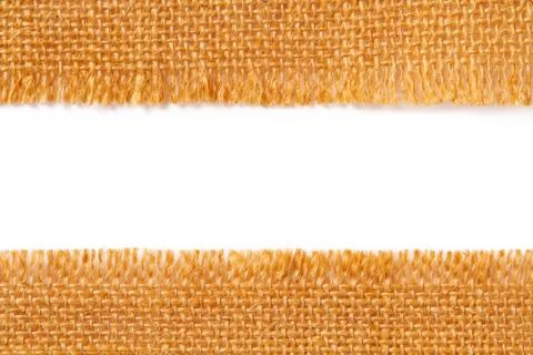 Border fabric texture of torn linen sacking cloth, ripped edge of hessian Stock Photos